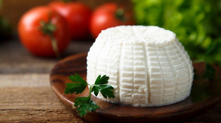 Ricotta cheese on a wooden plate